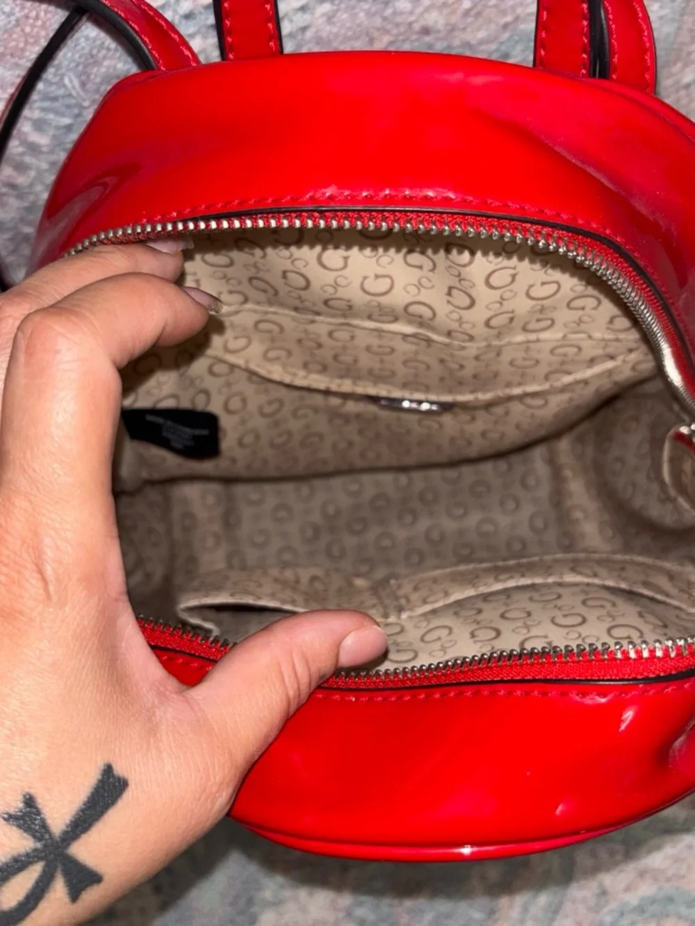 GUESS Red Patent Backpack with Triangle Charm